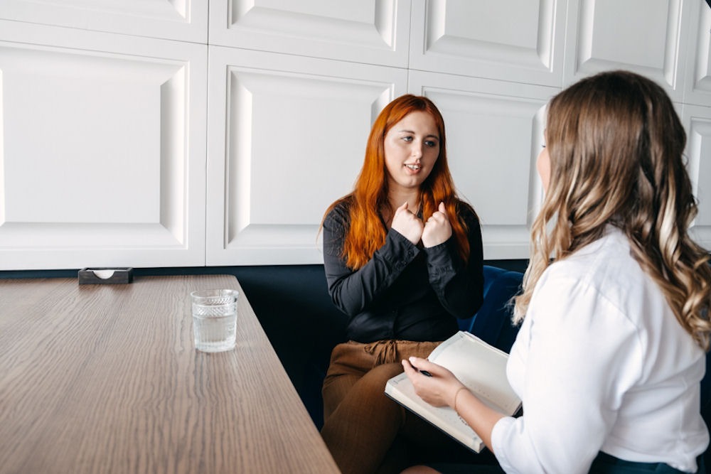 Young women talking about bipolar disorder symptoms